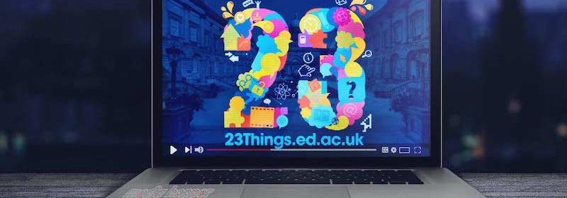 laptop with 23 Things logo background