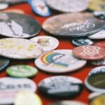 Photograph of a pile of button badges