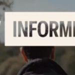 HIV Informed. Picture of the back of a man's head and shoulders as he walks through green trees.