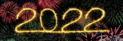 2022 in yellow lettering against a black background with fireworks