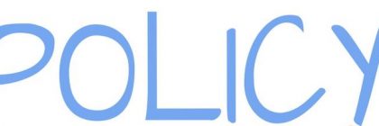 The word policy being written by a hand with a blue pen