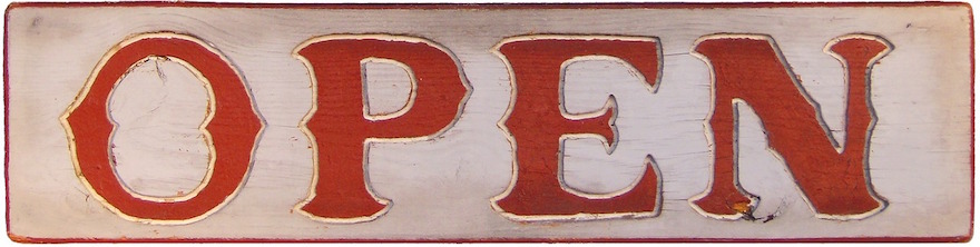 Weathered sign with red letters "OPEN"
